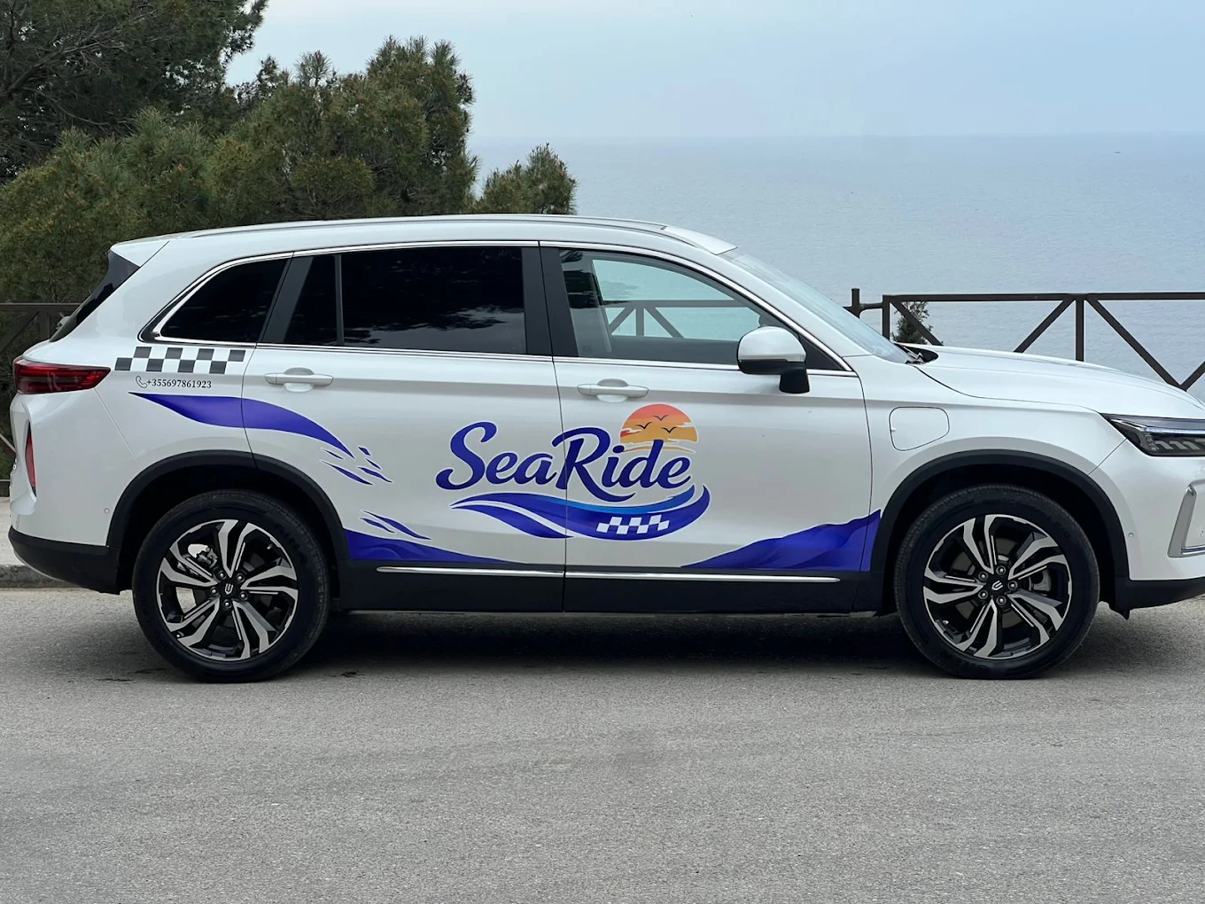 Sea Ride Taxi electric SUV parked above the Adriatic coast near Durrës